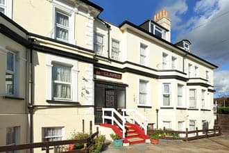 St Claire’s, a cream Victorian building with red front steps on Claremont Road